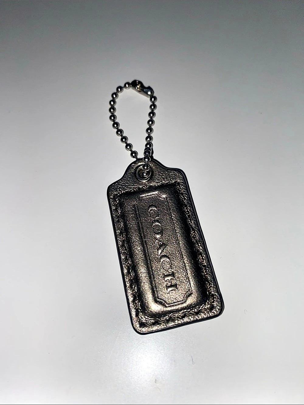 Vintage Coach Leather Metallic Tag